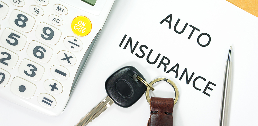 Auto insurance with car key and calculator